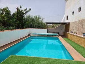 a swimming pool on the side of a building at Molino de Las Pilas - Ecoturismo - Caminito del Rey in Teba