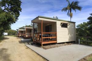 a row of cottages parked in a row at Reflections Nambucca Heads - Holiday Park in Nambucca Heads