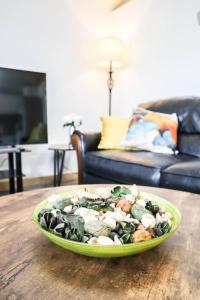 a bowl of food on a table in a living room at Unique 1 bed Flat Near Heathrow in Hillingdon