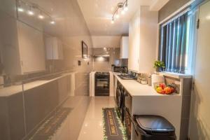 a kitchen with a counter with a bowl of fruit on it at Entire home in Nottingham in Nottingham