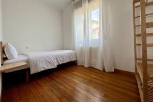 Llit o llits en una habitació de Casa en la Playa de Agrelo Portomaior