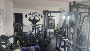 a gym with several tread machines in a room at Tablas Seaview Residencial in Ferrol