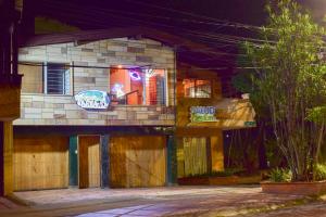 a building with a sign on the side of it at AREA 51 HOSTEL in Medellín