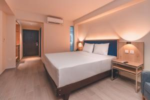 Cama o camas de una habitación en Lyz Business Hotel Piura