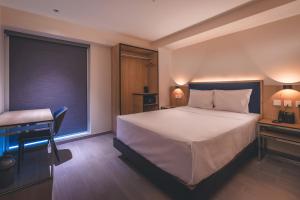 Cama o camas de una habitación en Lyz Business Hotel Piura