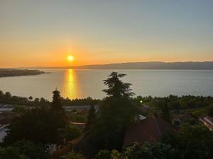 a sunset over a large body of water at Elit view home in Sapanca