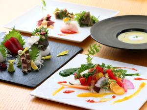 three plates of food sitting on a table at Kotsubokaigan Linca in Zushi