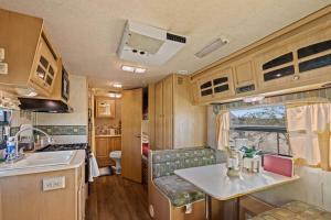 an rv kitchen with a sink and a counter at JT Village Campground - Star Stream in Joshua Tree