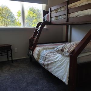 a bedroom with a bunk bed and a window at Lavender Row Farm 