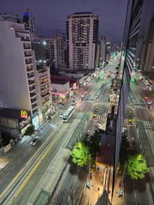 a view of a city street at night with traffic at Belgrano BLUE Apartment in Buenos Aires