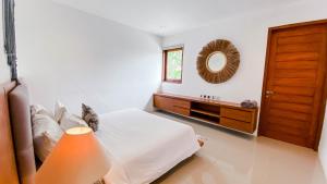 Ein Bett oder Betten in einem Zimmer der Unterkunft Casa Naima Petitenget Villa