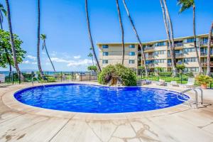 a large swimming pool in front of a building at Condos in Kana'i A Nalu in Wailuku