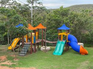 a playground with a slide and a slideintend at Boutique Hotel Casa de Guimarães in Chapada dos Guimarães
