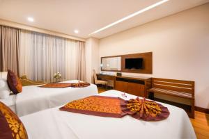 Postelja oz. postelje v sobi nastanitve Minh Toan Galaxy Hotel