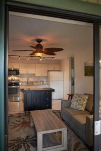 a living room and kitchen with a couch and a table at South Maui 1 BR Guest Suite - Kamaole Beach Area in Wailea