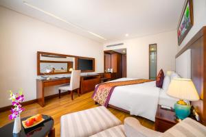 Postelja oz. postelje v sobi nastanitve Minh Toan Galaxy Hotel
