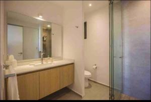 a bathroom with a sink and a toilet and a shower at 313 Paraíso frente al mar in Nuevo Vallarta +30 photos