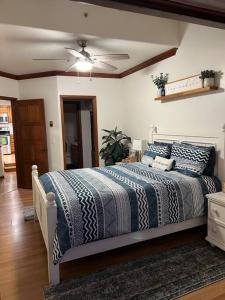 a bedroom with a bed and a ceiling fan at Hamilton Cove Panoramic Ocean View Condo #2/32 in Avalon