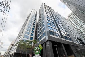 a tall building with balloons in front of it at UH FLAT The Seocho in Seoul