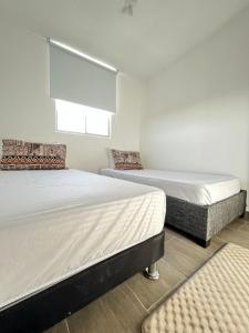 Tempat tidur dalam kamar di Apartamento 30min del Mar