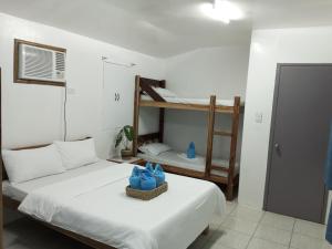 Postel nebo postele na pokoji v ubytování LALUNA COTTAGES