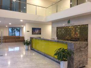 a lobby with a reception desk in a building at Annie House Hạ Long Bay in Ha Long