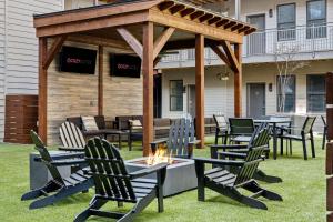 a gazebo with chairs and a fire pit at CozySuites Music Row Spacious 2BR w free parking01 in Nashville