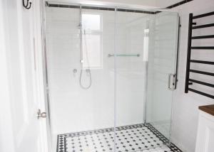 a shower with a glass door in a bathroom at The Bower Mudgee in Mudgee