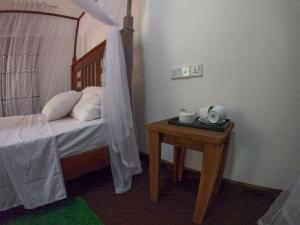 Letto o letti in una camera di Wilpattu Mookalan Resort