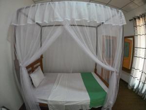 Letto o letti in una camera di Wilpattu Mookalan Resort