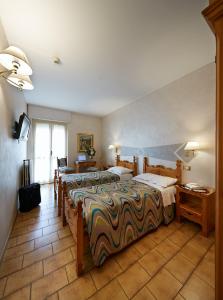 Un pat sau paturi într-o cameră la Hotel Ristorante Da Politano