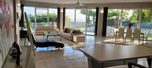 a living room with a couch and a table at Mythos luxury apartments in Corfu