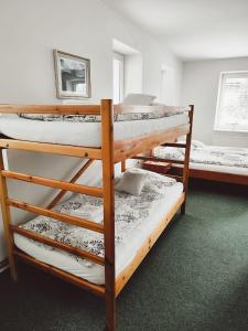 a group of bunk beds in a room at Ubytování Goliáš in Krásná Lípa