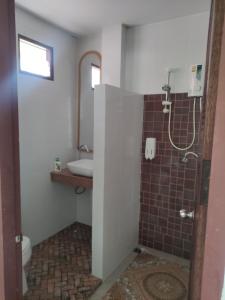 a bathroom with a shower and a sink at Luana Villas in Ban Mo Nae