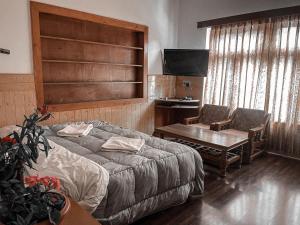 Hotel shaynam客房内的一张或多张床位