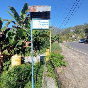 a street sign on the side of a road at WATUGANA BUNGALOW KELIMUTU in Kelimutu