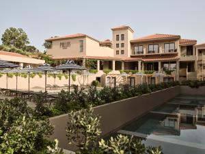 - Vistas a la piscina del complejo de cerdos en Hotel Pallas, en Laganas