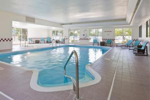 a large swimming pool in a hotel room at Residence Inn by Marriott Cedar Rapids in Cedar Rapids
