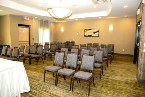 a room with a bunch of chairs in it at Courtyard by Marriott Toronto Brampton in Brampton