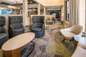 a waiting area in a hospital with chairs and tables at Courtyard Spokane Downtown at the Convention Center in Spokane
