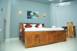 SP Tourist Hotel Jaffna客房内的一张或多张床位