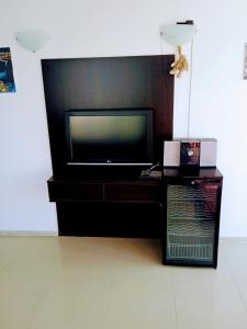 a flat screen tv sitting on top of a table at VIP apart SVETLANA in Ravda +71 photos