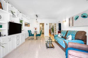 a living room with a couch and a tv at Selene in Calpe