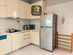 a kitchen with a stainless steel refrigerator at Yemala Suites at Skyloft - Johor in Johor Bahru