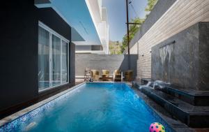 a swimming pool with a ball in a house at Sunflower Villa in Lonavala