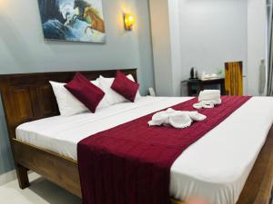 SP Tourist Hotel Jaffna客房内的一张或多张床位