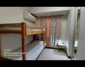 Postel nebo postele na pokoji v ubytování MANILABAY HOME + 20 fotografií