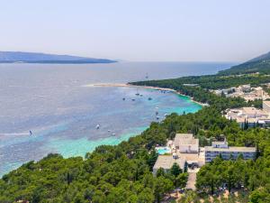 an aerial view of a beach with boats in the water at Bluesun Hotel Borak in Bol