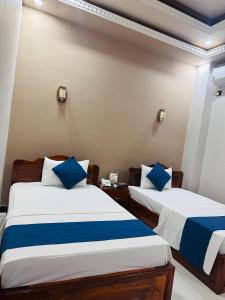 SP Tourist Hotel Jaffna客房内的一张或多张床位