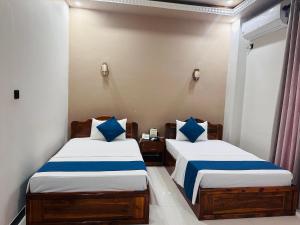 SP Tourist Hotel Jaffna客房内的一张或多张床位